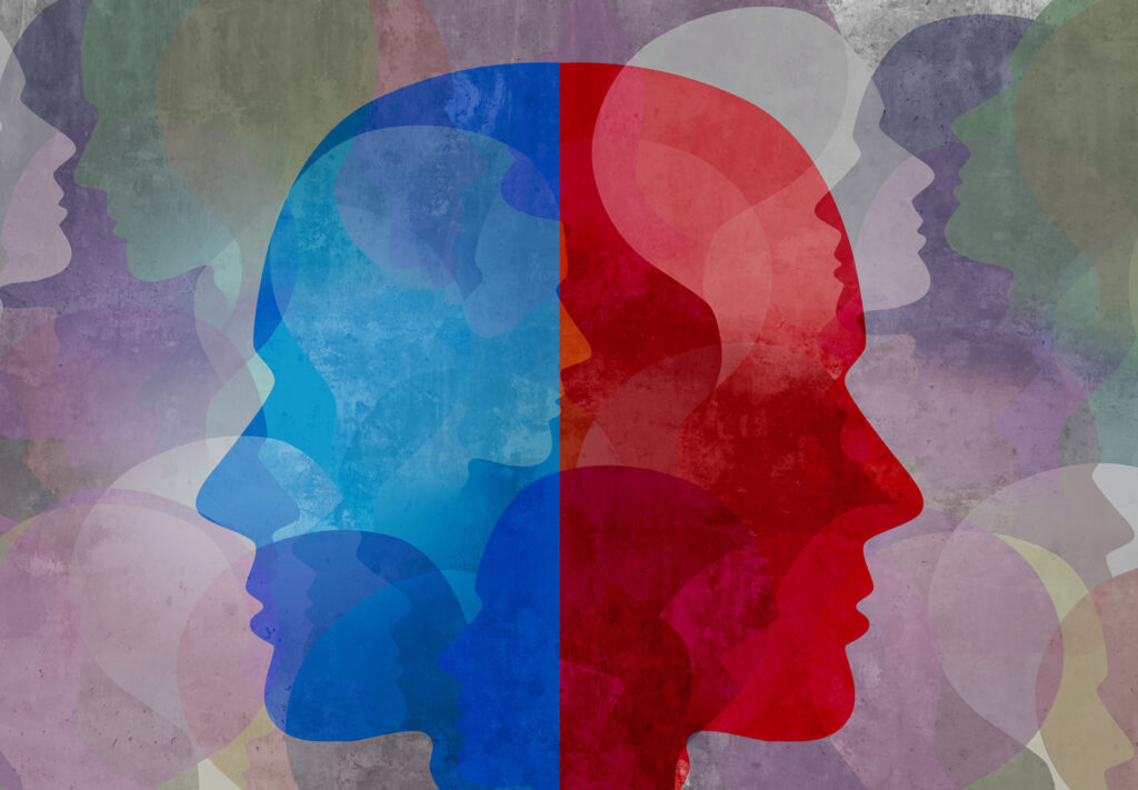 Two side profiles of heads are back to back. One is red, the other is blue.