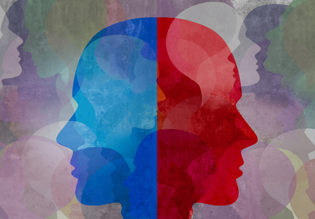 Two side profiles of heads are back to back. One is red, the other is blue.