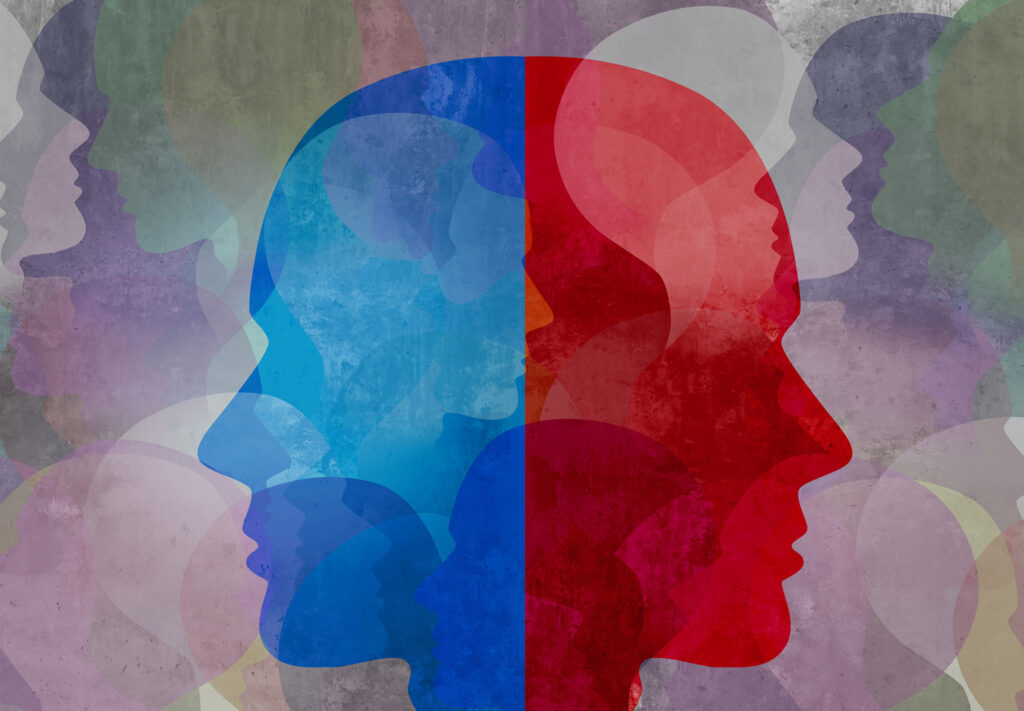 Two side profiles of heads are back to back. One is red, the other is blue.